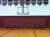 plain burgundy wall pads high school gymnasium
