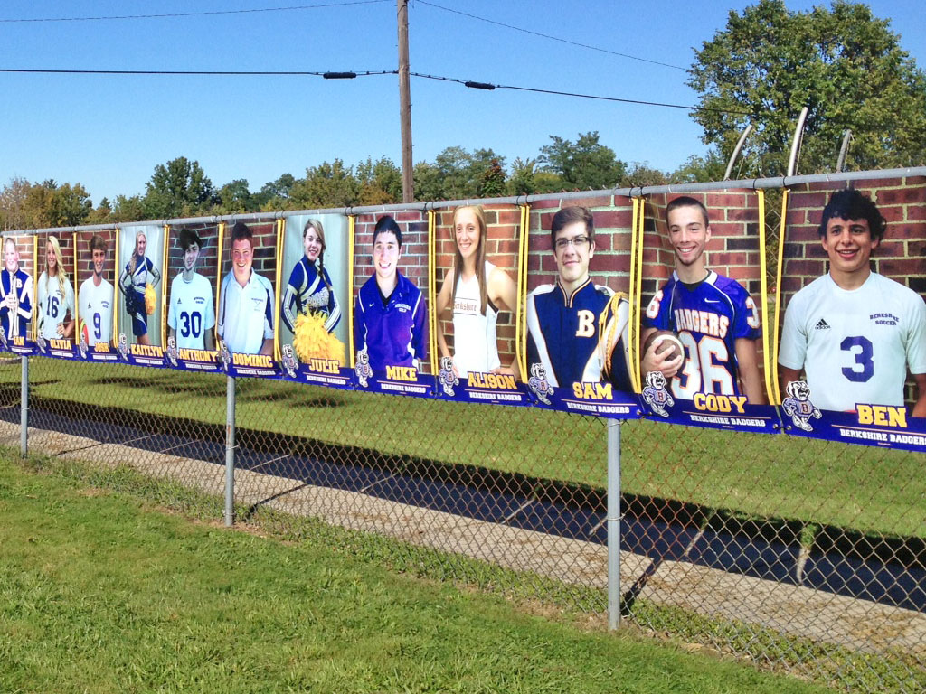 senior banner fence fall sports on stadium fence