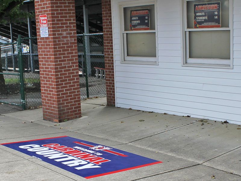 cardinal country power grip on sidewalk near Thomas Worthington Stadium