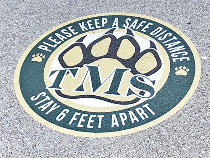 power grip covid graphics on pavement